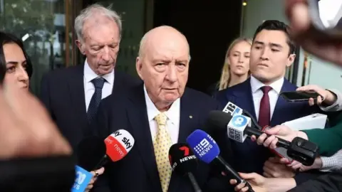 Sexual Assault Accusations Targeting Top Aussie Media Personality Downgraded